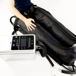 A person using the Aquilo Cryo-compression recovery system. 