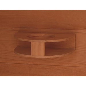 Wooden cup holder attached to the wall of the sauna