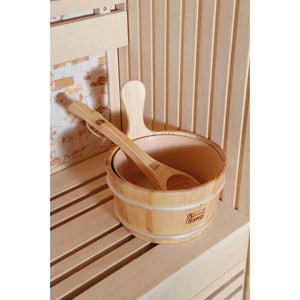 Wooden bucket and spoon inside the sauna